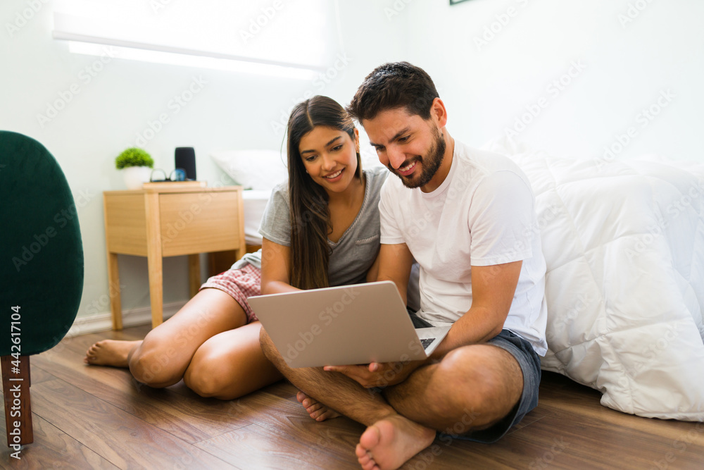 Young boyfriend and girlfriend searching online products Young boyfriend and girlfriend searching online products