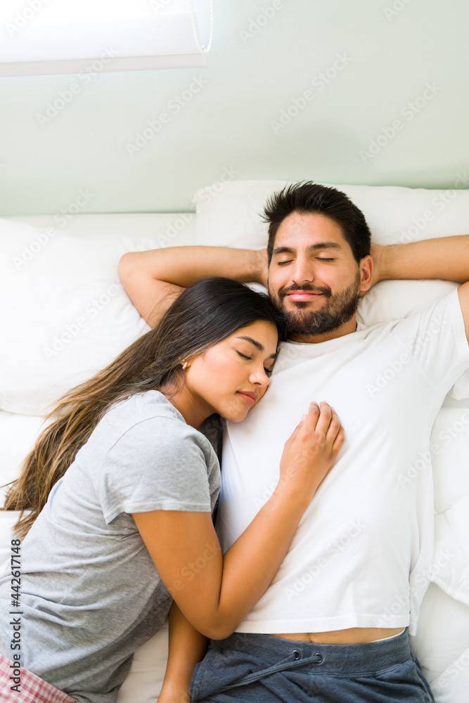 Attractive couple in pjs falling asleep together Attractive couple in pjs falling asleep together