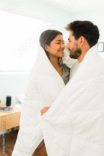 Boyfriend and girlfriend hugging and staying warm