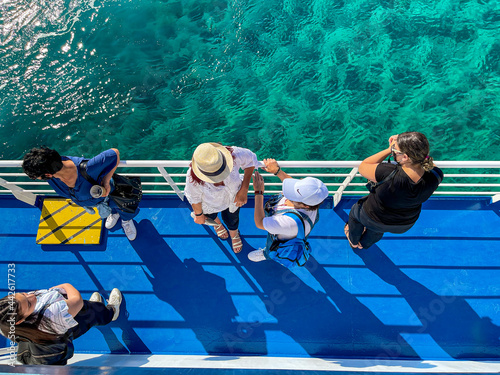 Canvastavla Scenic top down view of women traveling on deck of ferry boat
