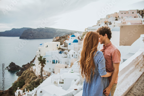 Young couple embracing on authentic coastal town street photo