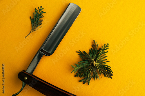 Straight razor, cut-throat with a wood handle