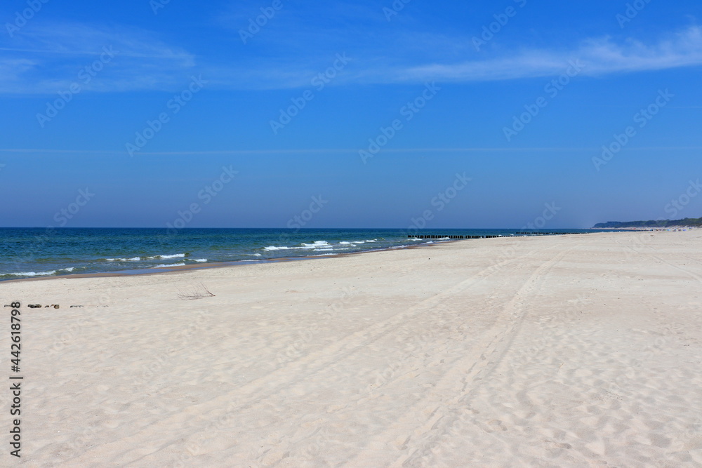 sea beach in the first sunny days of summer, Dziwnów, Poland	
