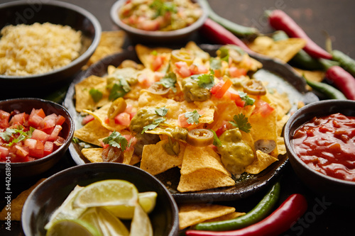 Fresh yellow corn nacho chips on ceramic plate