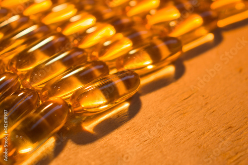 capsules on a wooden table