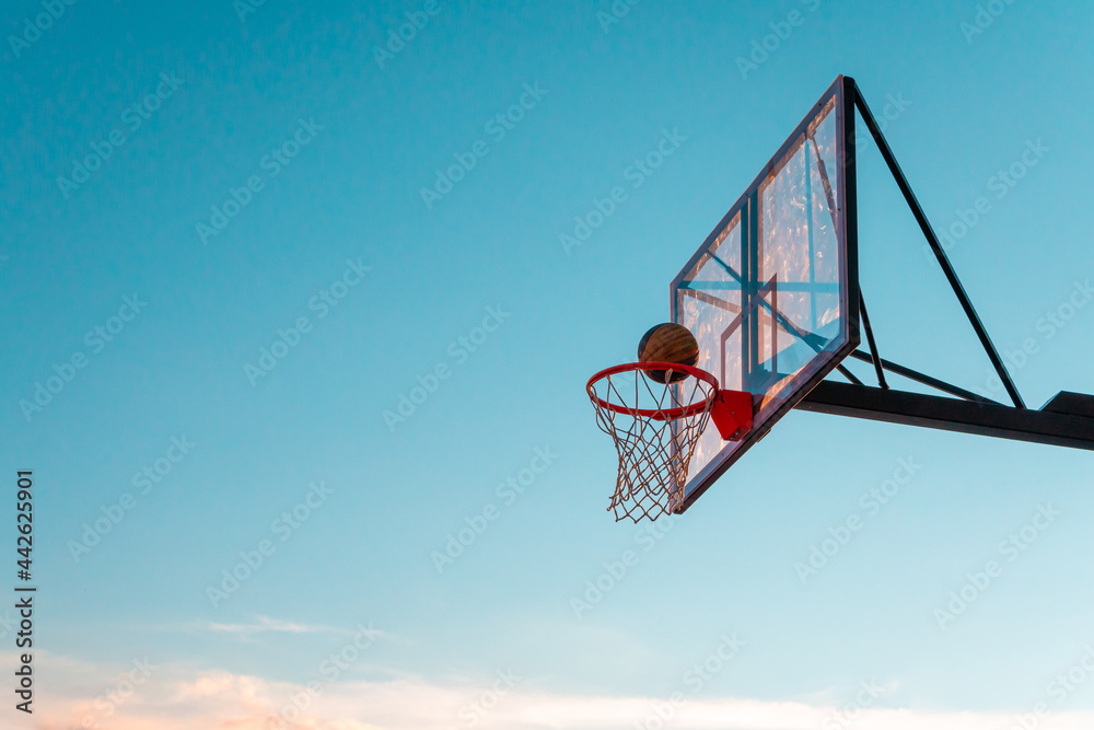 A basketball basket with a ball A basketball basket with a ball