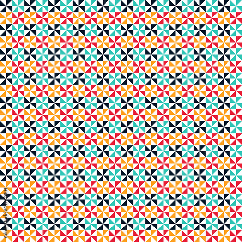 Patrón geométrico de aspas de colores sobre fondo blanco.
