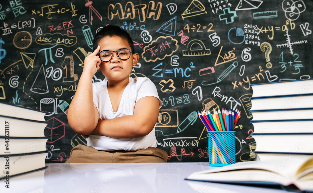 Fototapeta premium Child sitting and acting in the classroom