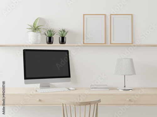 A working room with a computer placed on the table