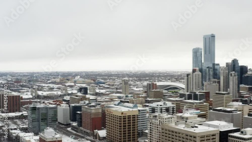 Aerial panoramic North to East view of snow cover empty vacant airport lot around Oliver Grandin Kingsway community of Downtown Edmonton Canada to the Government residential commercial High rises photo