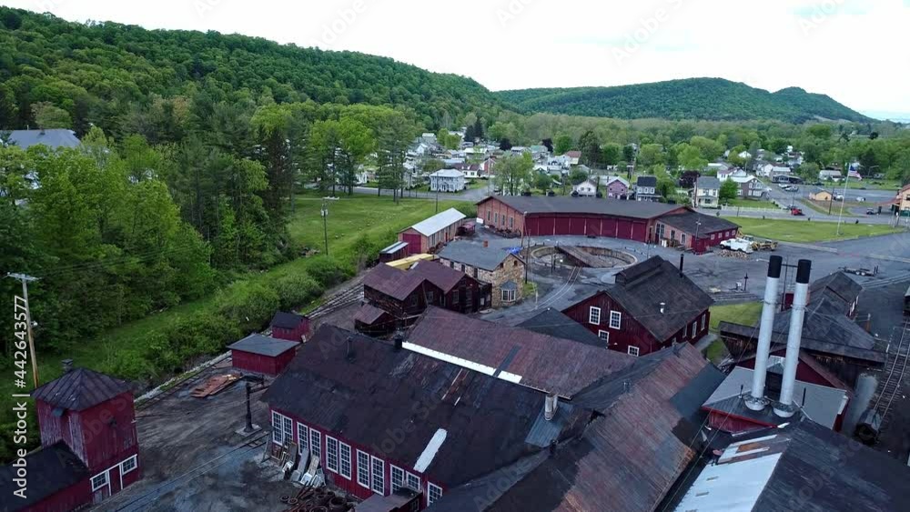 An Aerial View of an Abandoned Narrow Gauge Coal Rail Road Round House and Turntable and Support Building Starting to be Restored An Aerial View of an Abandoned Narrow Gauge Coal Rail Road Round House and Turntable and Support Building Starting to be Restored