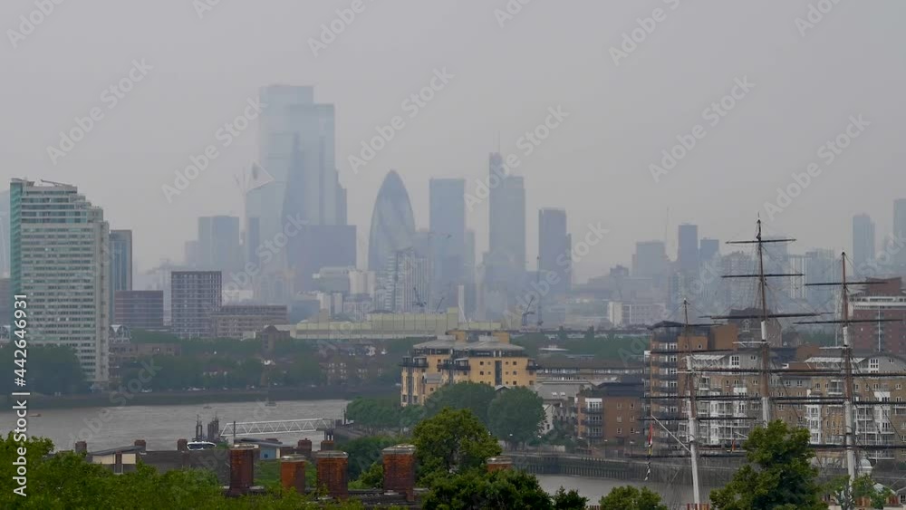 Capturing Central London from over in Greenwich Park in June 2021. The Skyscrapers popping out from the clouds. Capturing Central London from over in Greenwich Park in June 2021. The Skyscrapers popping out from the clouds.