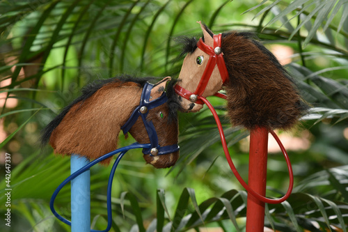 Fotografia Wooden and stuffed horses. Children's toy concept