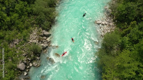 Aerial - Birds' view of three kayaks on a beautiful Soča river