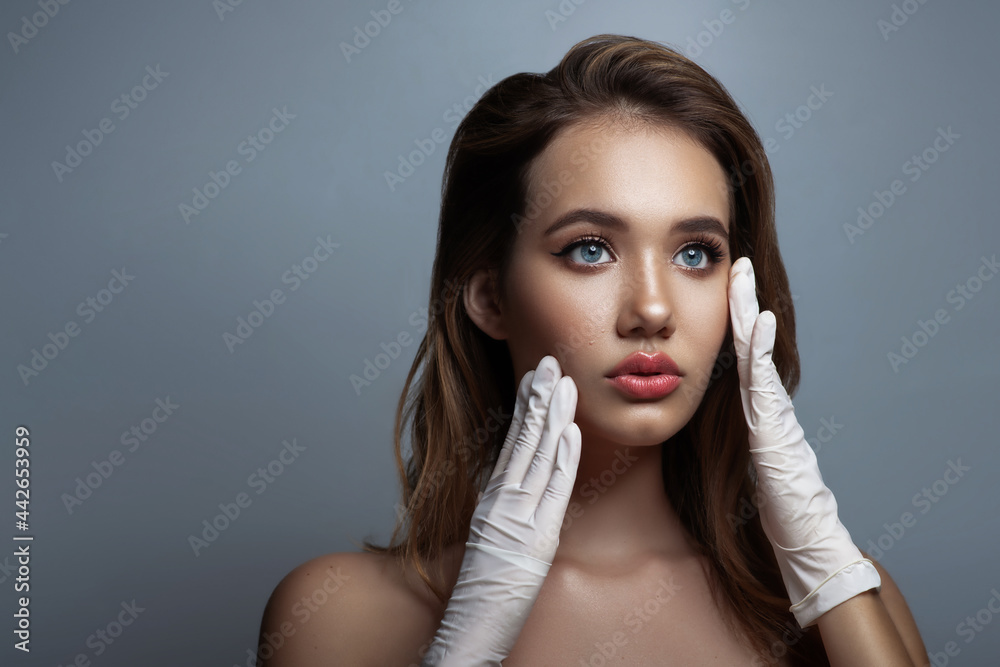 Face skin check before plastic surgery. Beautician touching woman face. Face skin check before plastic surgery. Beautician touching woman face.