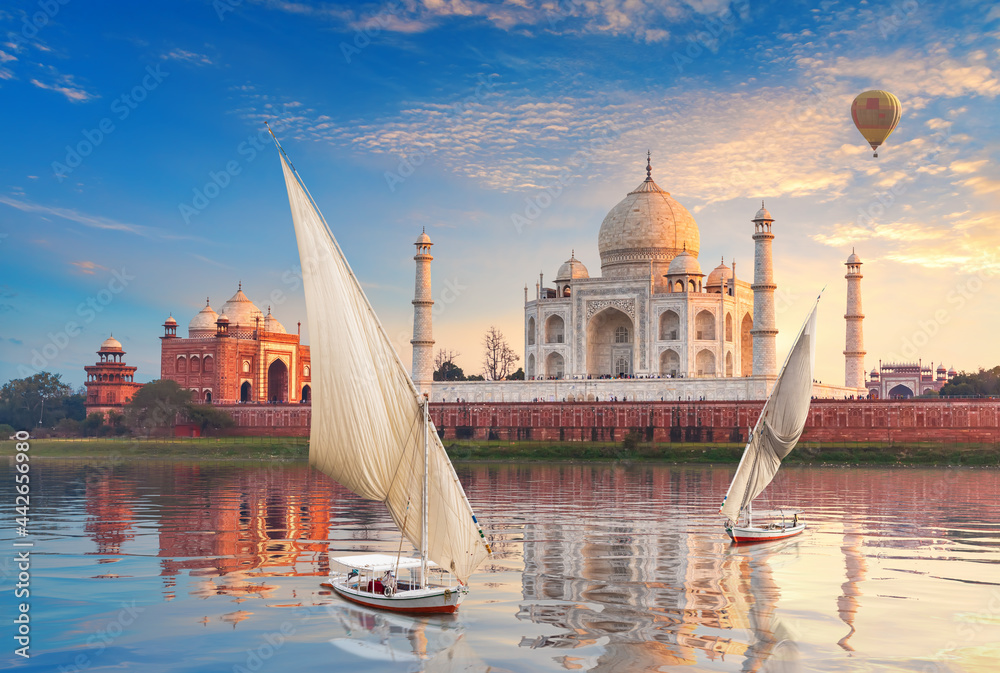 Taj Mahal and sailboats with air baloons in the Yamuna, Agra, Uttar-Pradesh, India