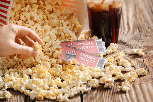 Female hand and tasty popco...
