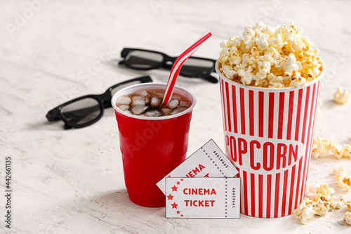 Tasty popcorn with cola and...