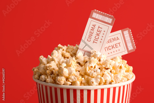 Bucket with tasty popcorn a...