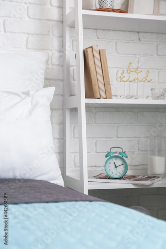 Book shelf with alarm clock...