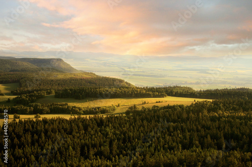 View from Great Szczeliniec  Szczeliniec Wielki highest peak of Stolowe Mountains to small  historic village of Pasterke and Czech part of Table Mountains with Koruna and Bozanovski Spicak peak Poland