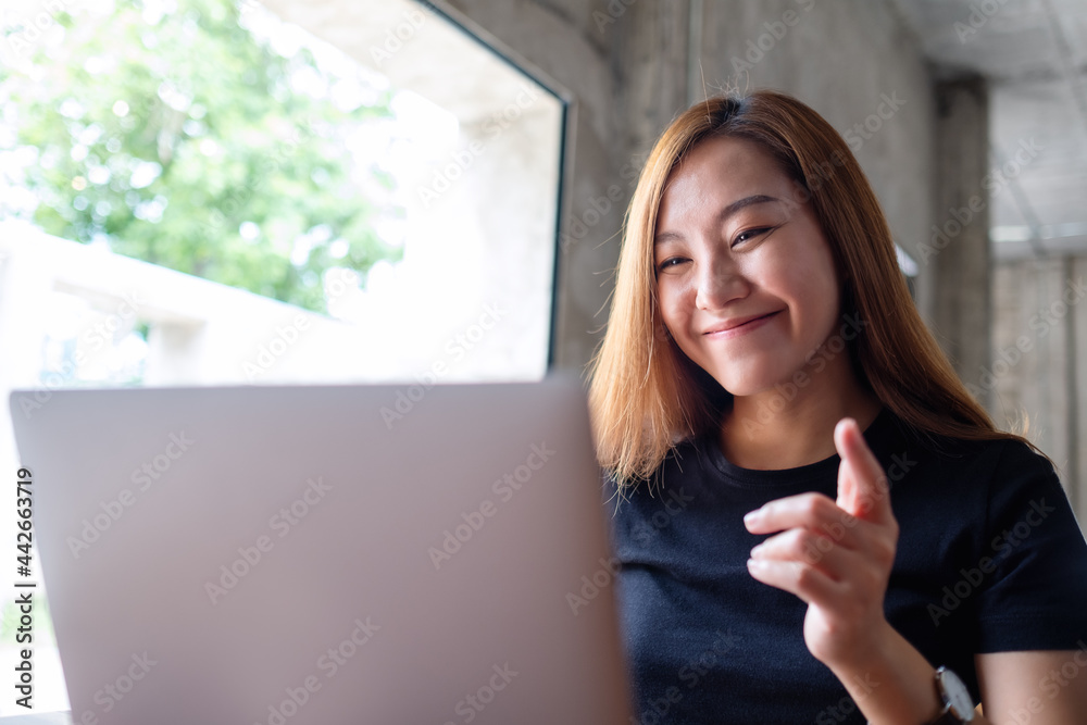 A businesswoman using laptop computer for working online and video conference A businesswoman using laptop computer for working online and video conference