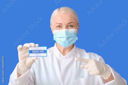 Doctor with immune card on ...