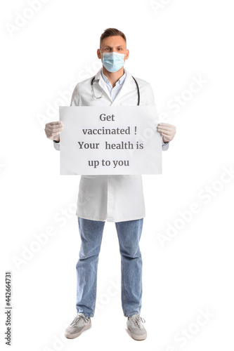 Male doctor holding poster ...
