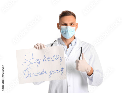 Male doctor holding poster with text STAY HEALTHY - VACCINATE YOURSELF on white background