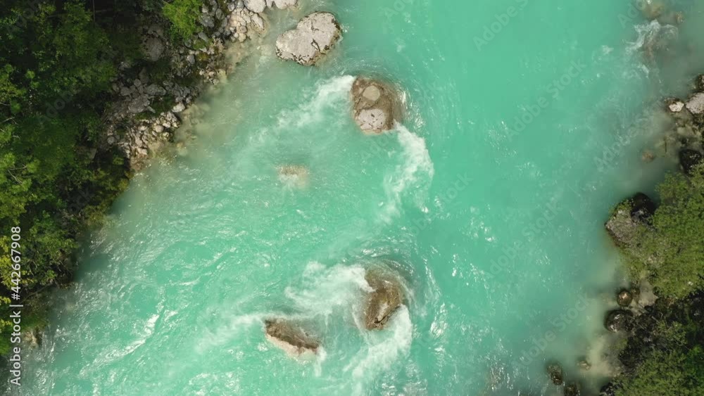 Aerial - Descending above Soča river. Top down view of emerald water Aerial - Descending above Soča river. Top down view of emerald water
