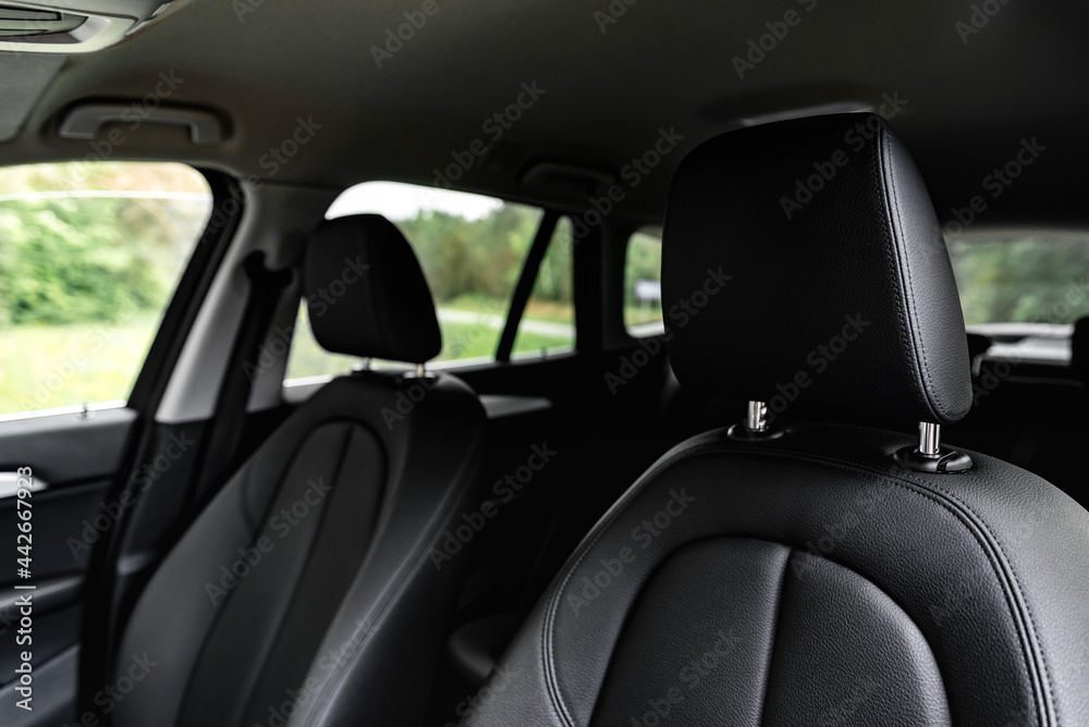 Modern car leather headrests. Interior detail.