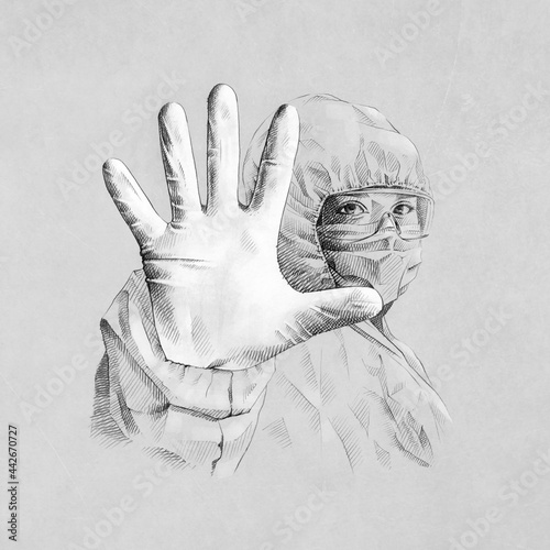 Anonymous physician showing stop gesture during COVID 19 photo
