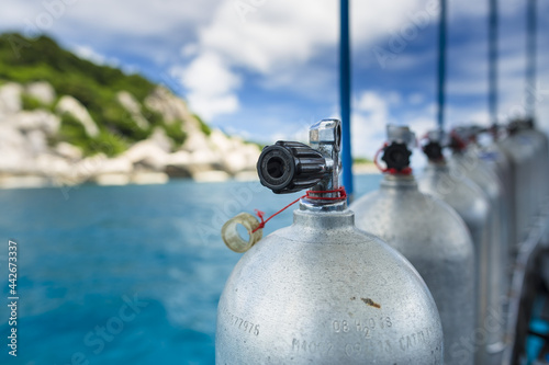 Scuba Diving Tanks and Equipment on a boat in the gulf of Thailand with copy space no people