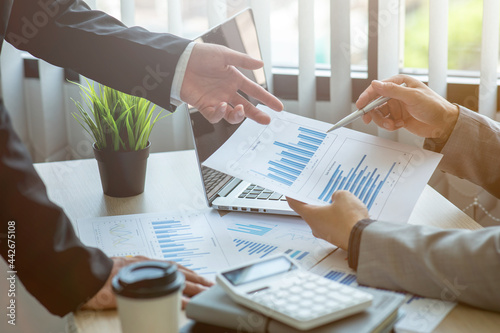 Quadro su tela Team of Business collaboration discussing working analyzing with financial data and marketing growth report graph,presentation and brainstorming to strategy planning of company