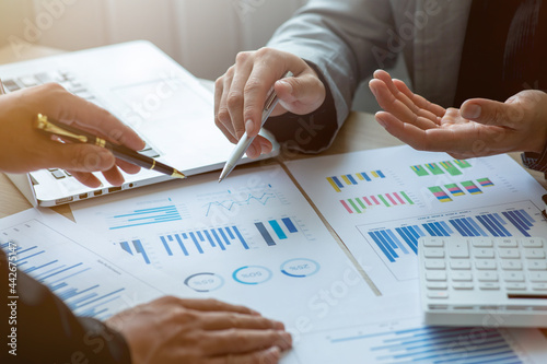 Quadro su tela Team of Business collaboration discussing working analyzing with financial data and marketing growth report graph,presentation and brainstorming to strategy planning of company