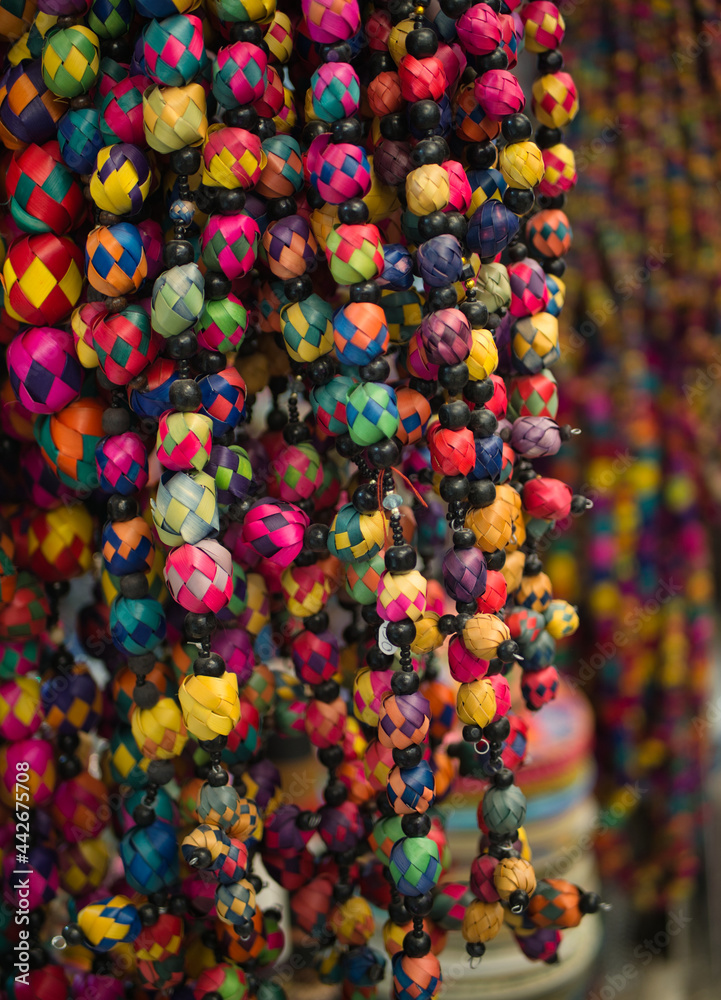 Colorful Mexican souvenirs (beads) sold at a market in San Miguel de Allende, Mexico. 2021.