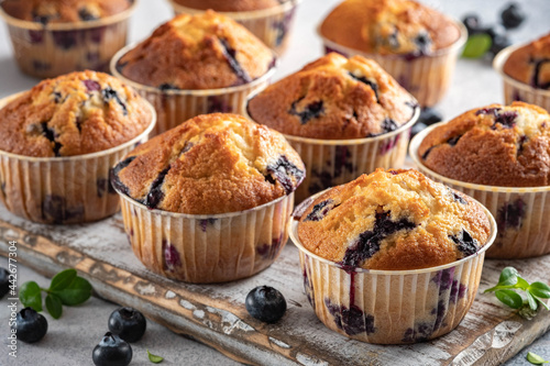 Homemade vegan blueberry muffins on white background.