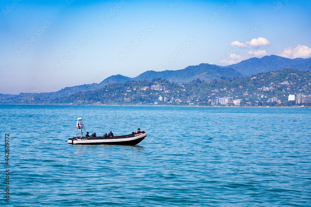 Batumi, Georgia - June 13, 2021: Rescue boat at sea Batumi, Georgia - June 13, 2021: Rescue boat at sea