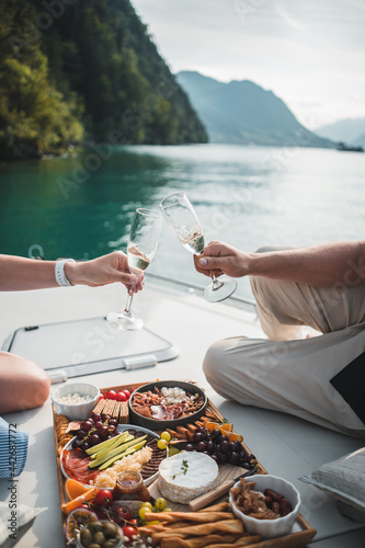 Couple enjoy view from boat at lake lucerne with prosecco