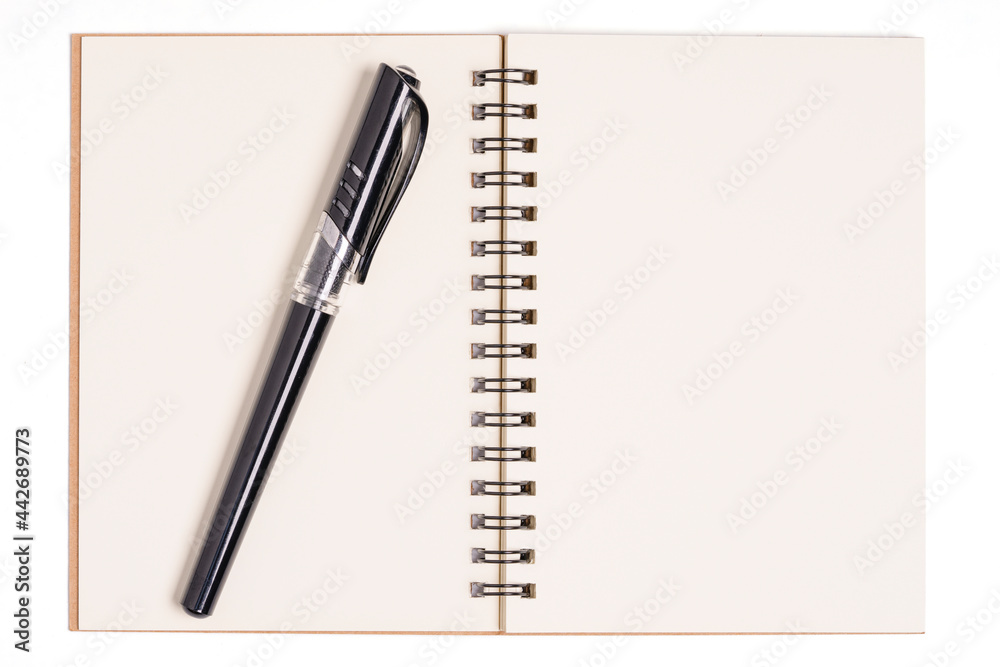 Top view of spiral kraft notebook front, open page on background Top view of spiral kraft notebook front, open page on background