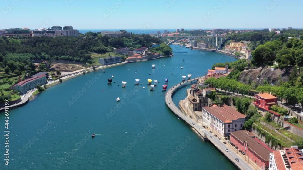 Cars Driving At The Viaduct With Rabelo Boats Regatta Racing At Douro River In Porto, Portugal. - aerial Cars Driving At The Viaduct With Rabelo Boats Regatta Racing At Douro River In Porto, Portugal. - aerial