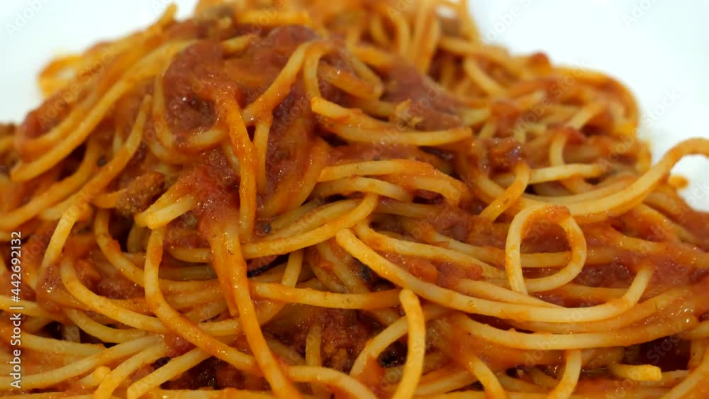 Close up of Sicilian spaghetti with sauce on white plate on the cafe table. Close up of Sicilian spaghetti with sauce on white plate on the cafe table.