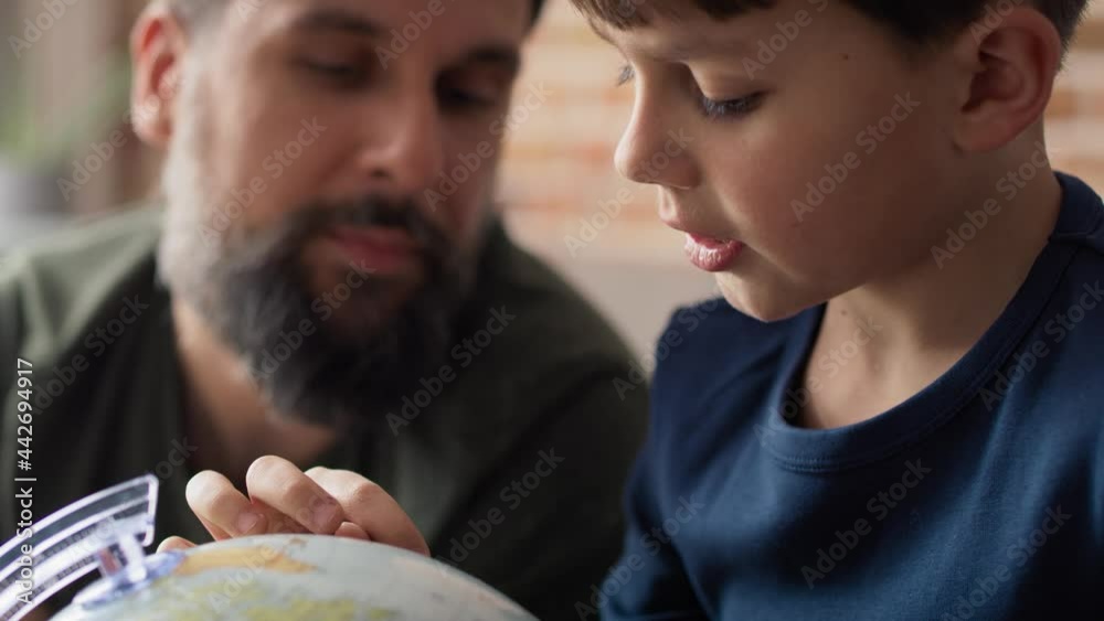 Close up video of father and son looking for a travel plan. Shot with RED helium camera in 8K. Close up video of father and son looking for a travel plan. Shot with RED helium camera in 8K.
