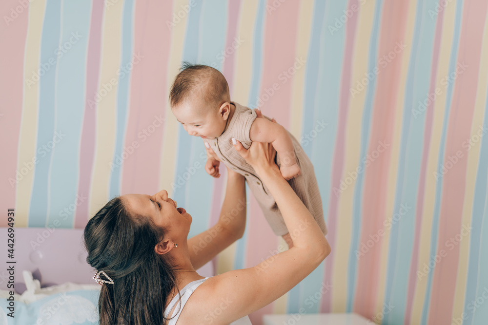 Young mother hugs her mixed race child. Child adoption and In Vitro Fertilization IVF Young mother hugs her mixed race child. Child adoption and In Vitro Fertilization IVF