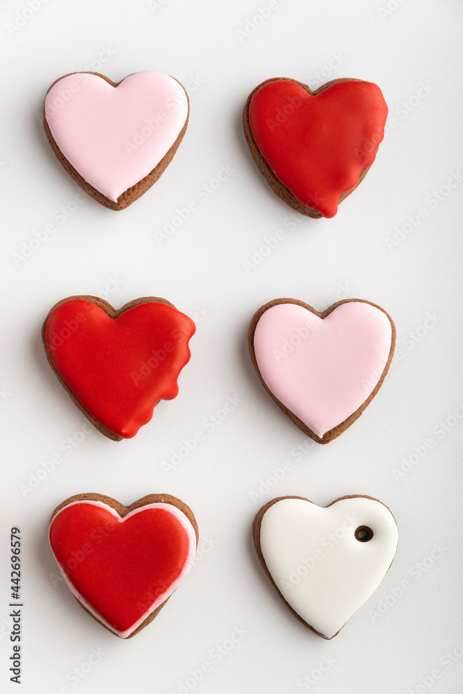 Gingerbread cookies with sugar icing on white background. Vertical frame