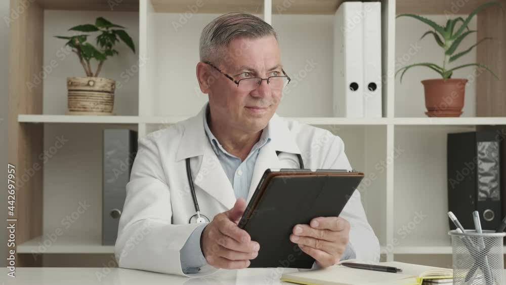 Portrait of Professional Male Doctor using Tablet Portrait of Professional Male Doctor using Tablet