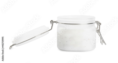 Open jar of exfoliating salt scrub isolated on white