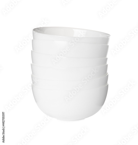 Stack of clean ceramic bowls isolated on white