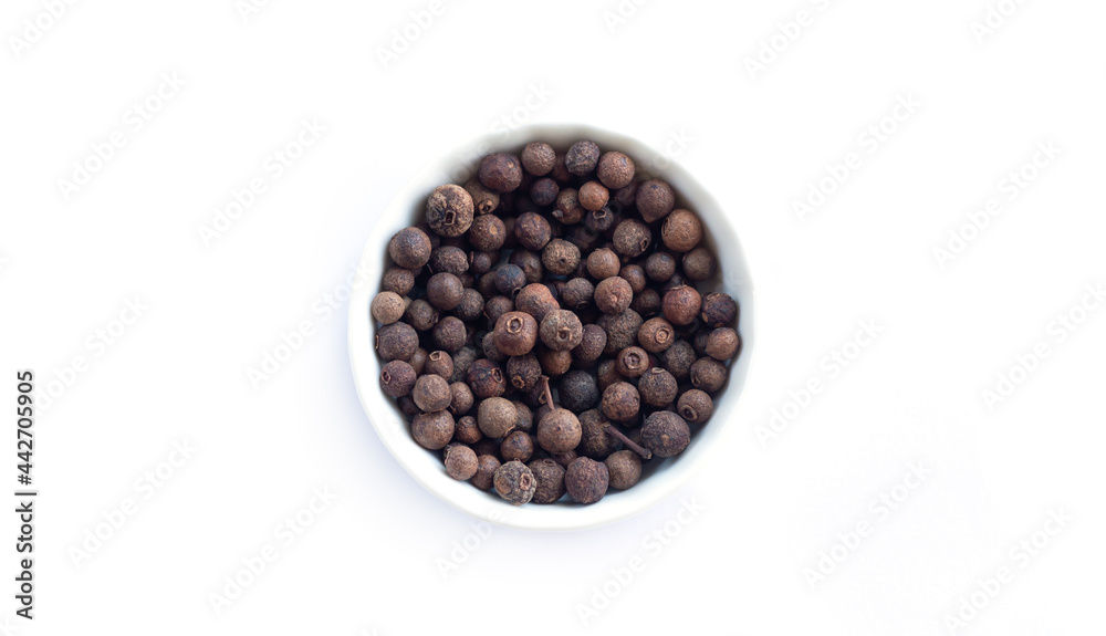 Bowl of allspice isolated on white background top view Bowl of allspice isolated on white background top view