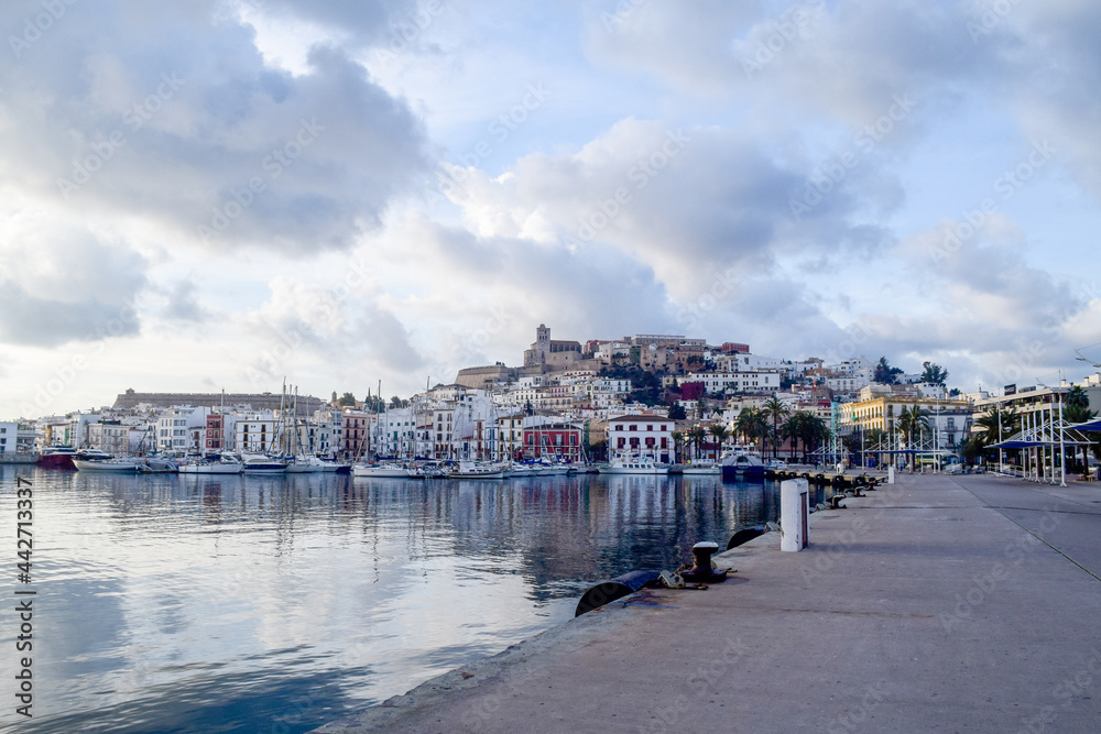 Landscape of Ibiza city mediterranean island with sky full of clouds in a sea port
